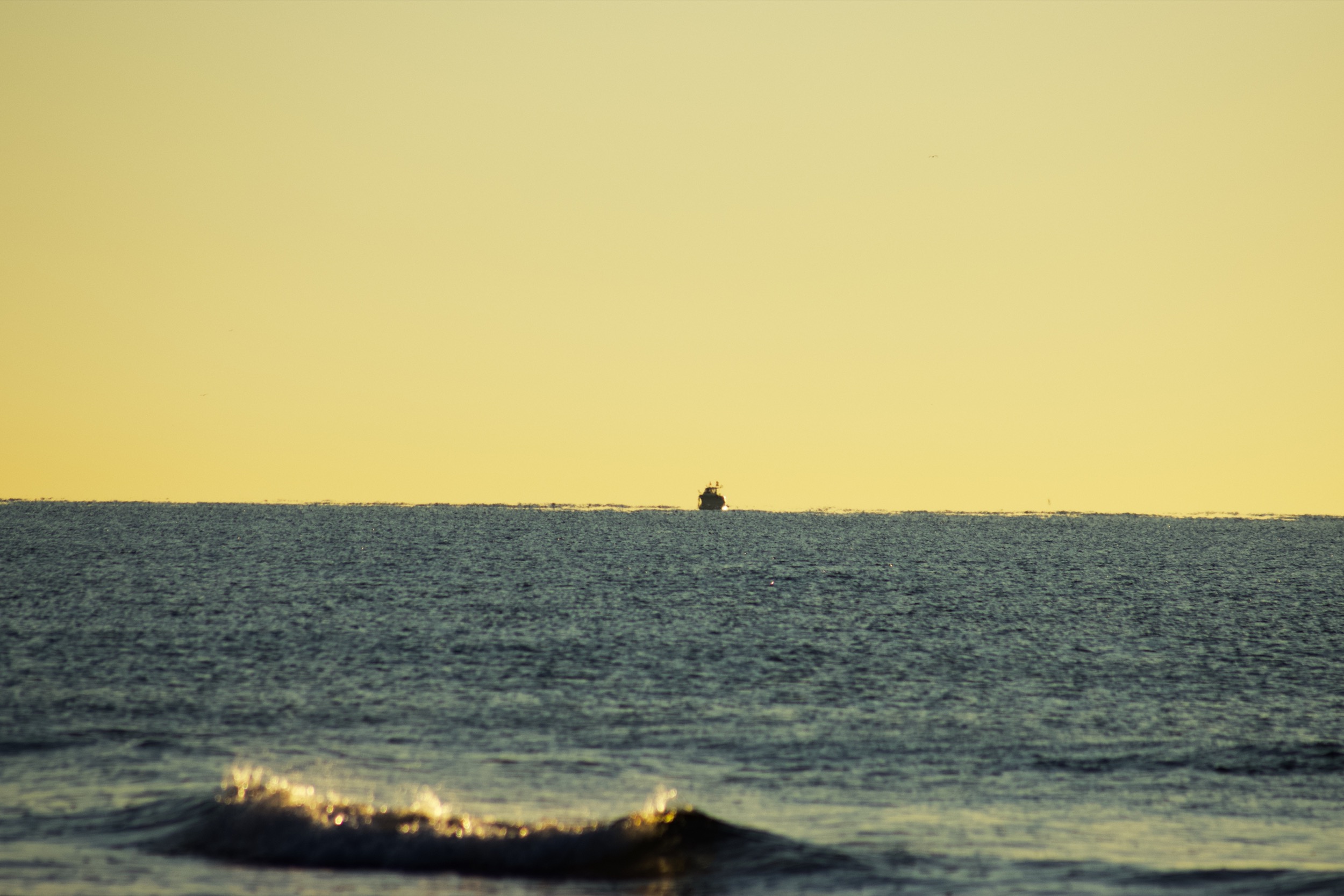 yellow sky with boat