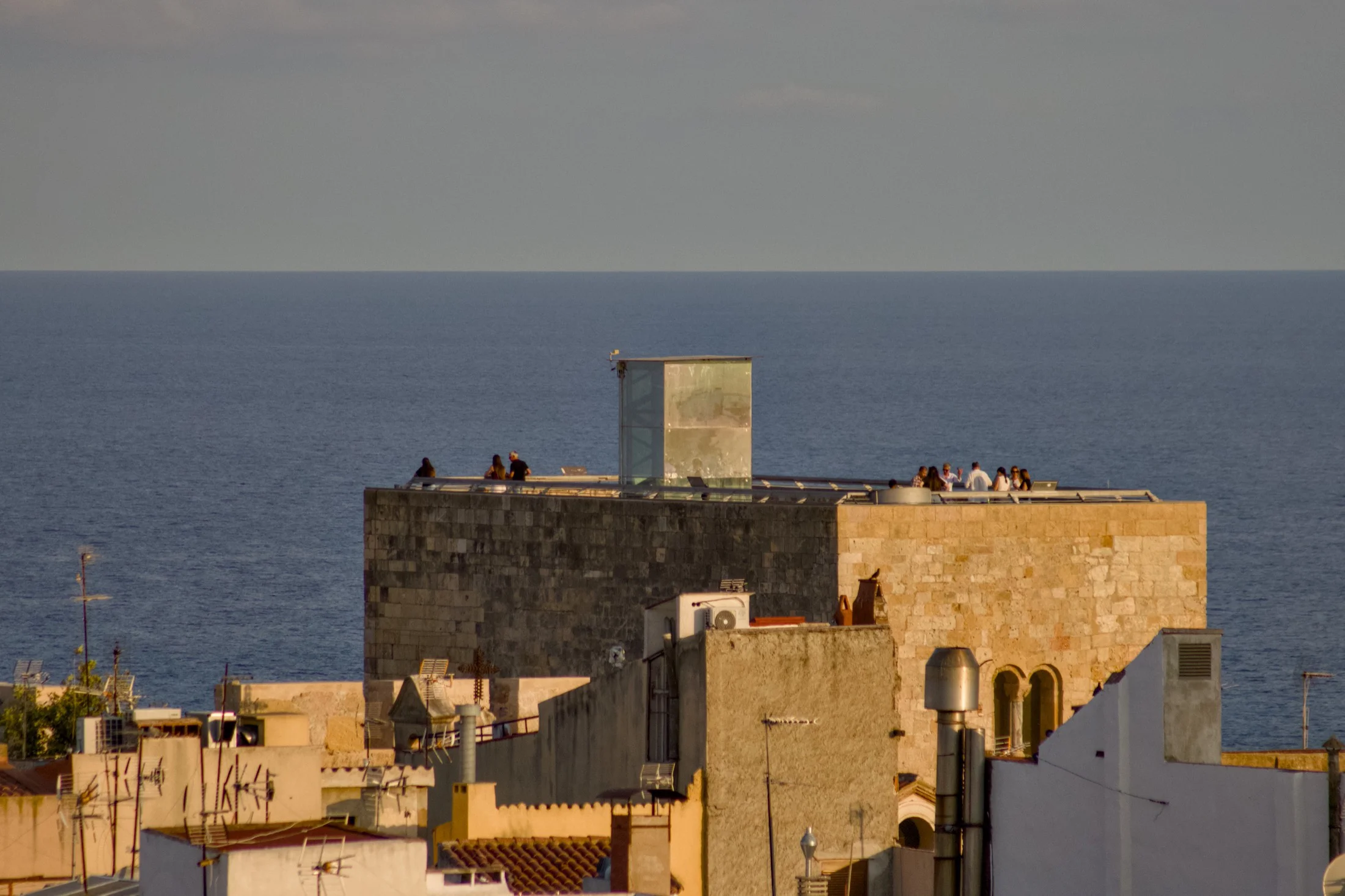 onlookers watching the eclipse from Tarragona
