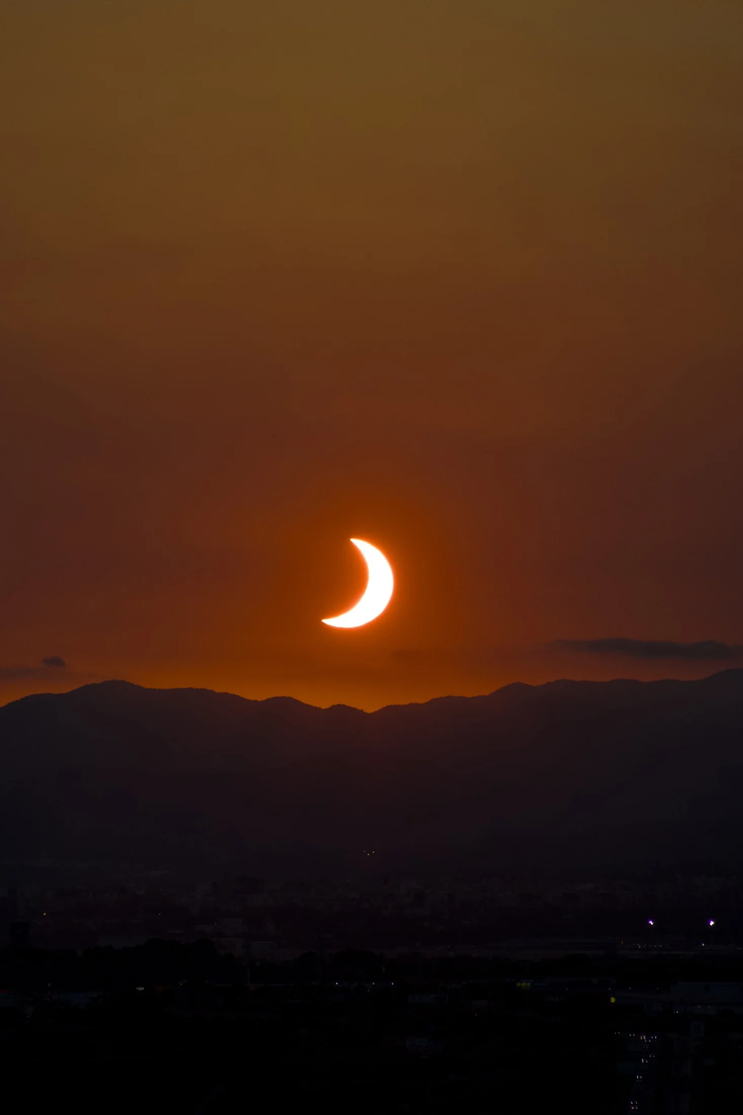 the eclipse fading over Tarragona's skyline