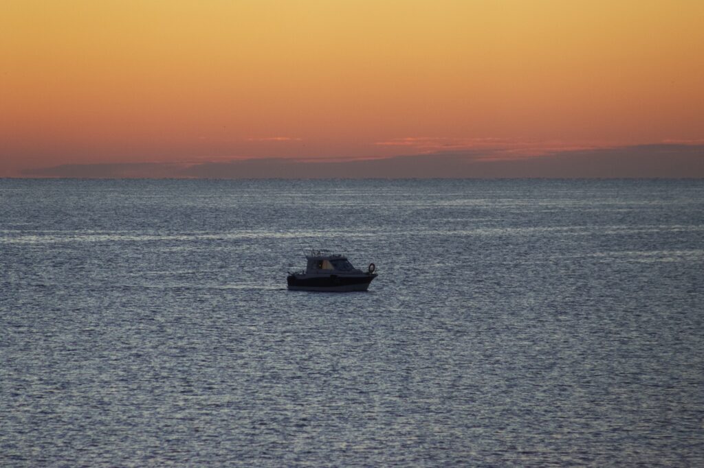 fishing boat at sunrise